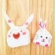 JZK 100pcs Bolsas caramelo bolsas embalaje regalos bolsas piscolabis bolsas en forma orejas conejo para niños fiesta favorece